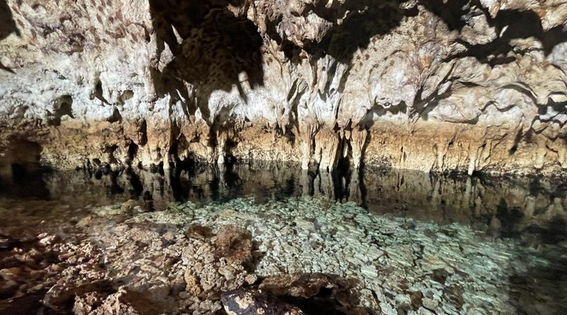 Coral cave with clear water — The Cave
